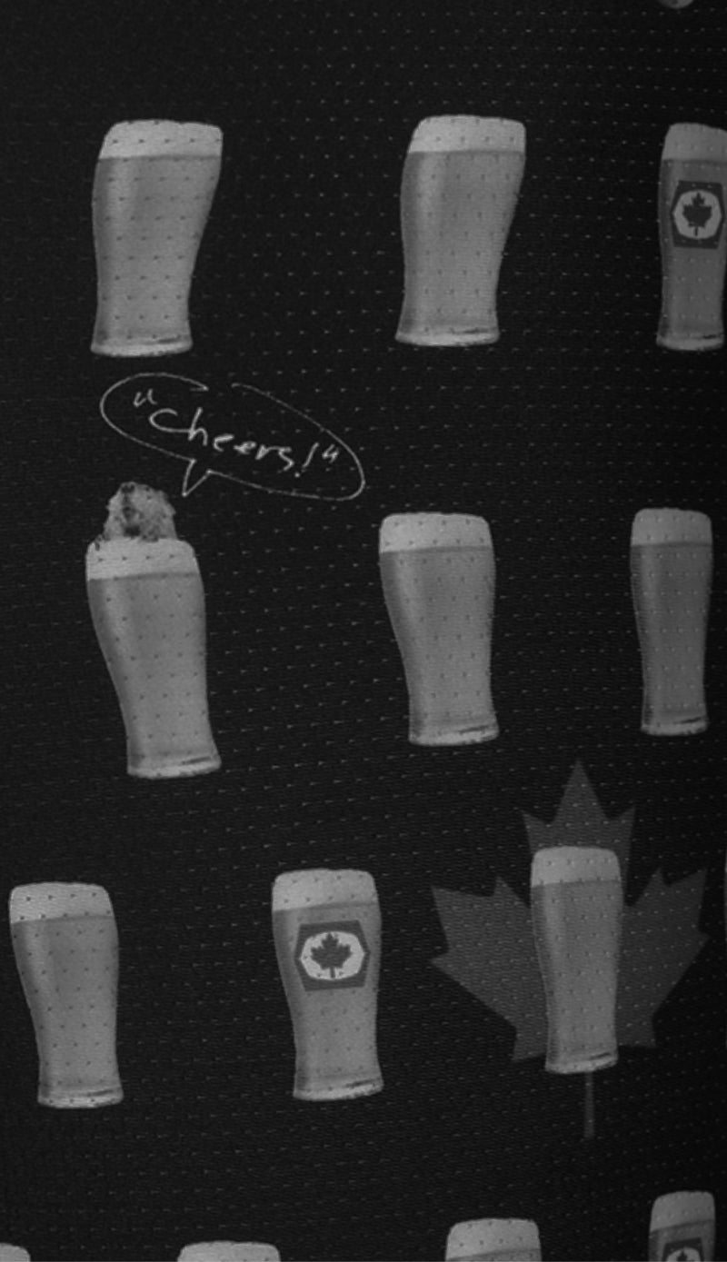 Pattern of beer glasses with a 'Cheers!' speech bubble and a maple leaf design on a black background.