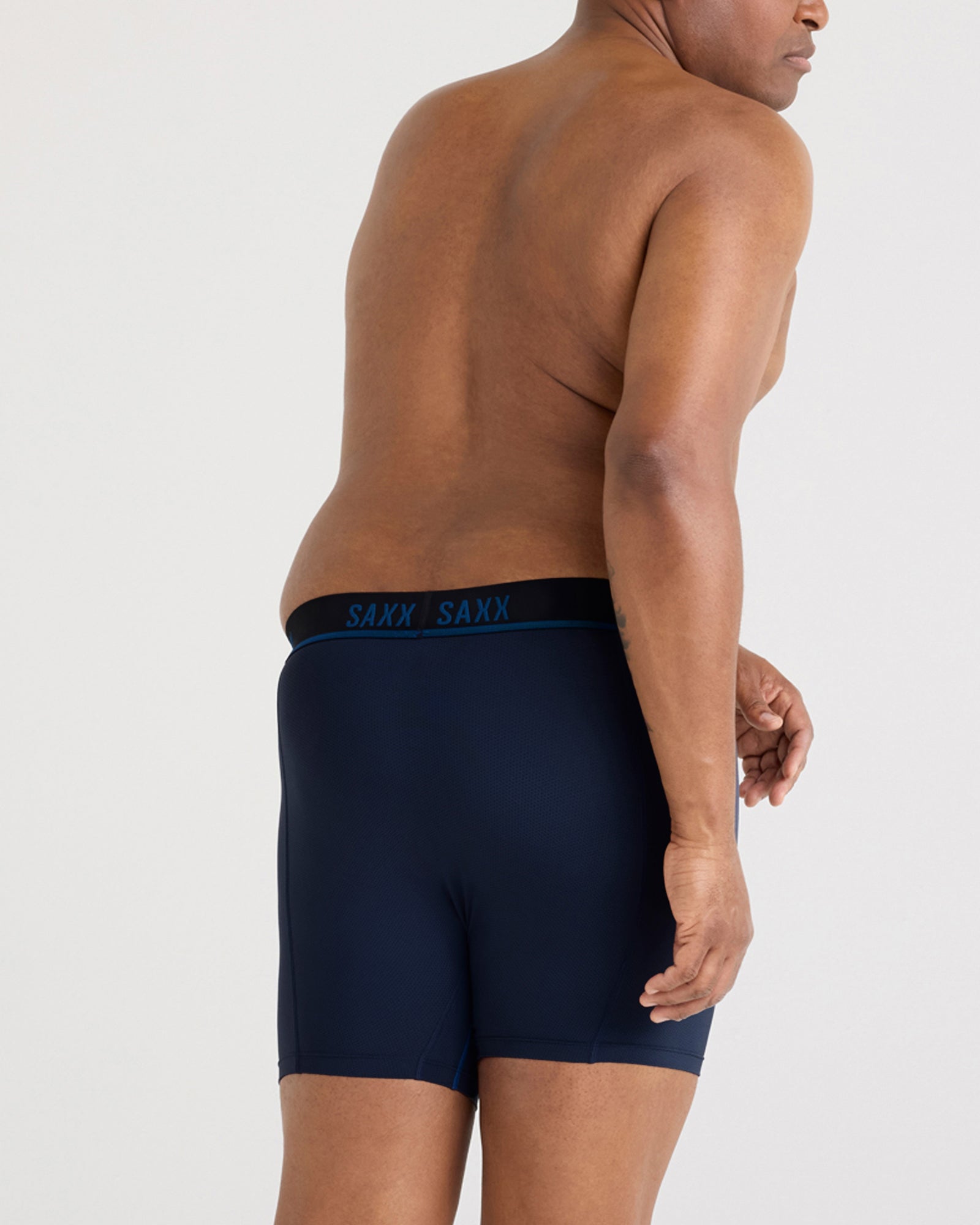 Back - Model wearing Kinetic Light-Compression Mesh Boxer Brief in Navy/City Blue