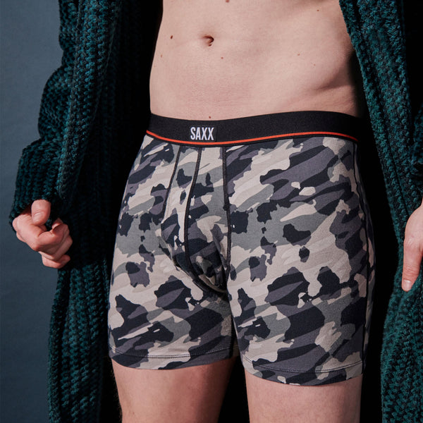 Model posing in Non-Stop Stretch Cotton Boxer Brief in Pop Grunge Camo- Graphite