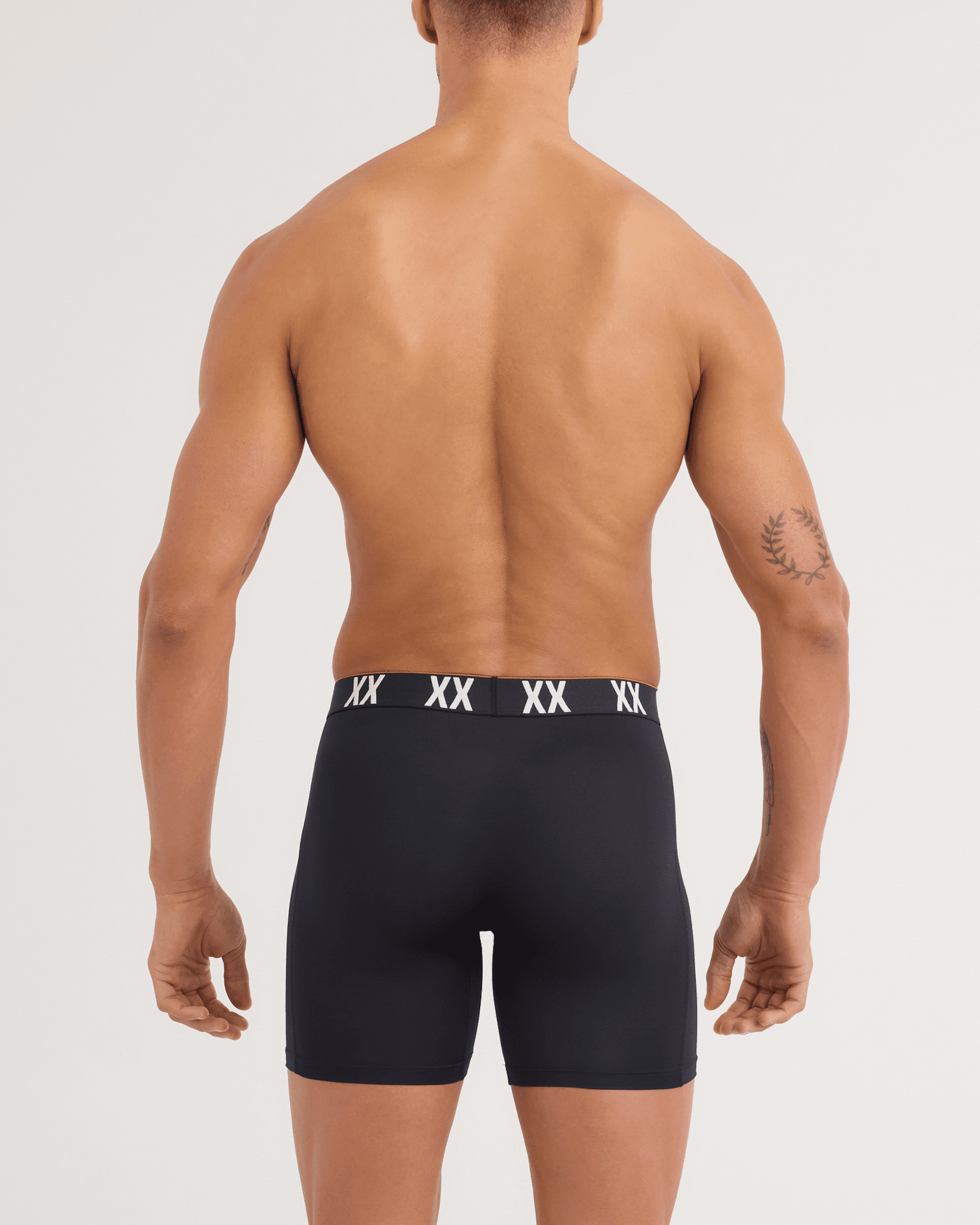 Back - Model wearing Multi-Sport Mesh Boxer Brief in Black/XX Waistband