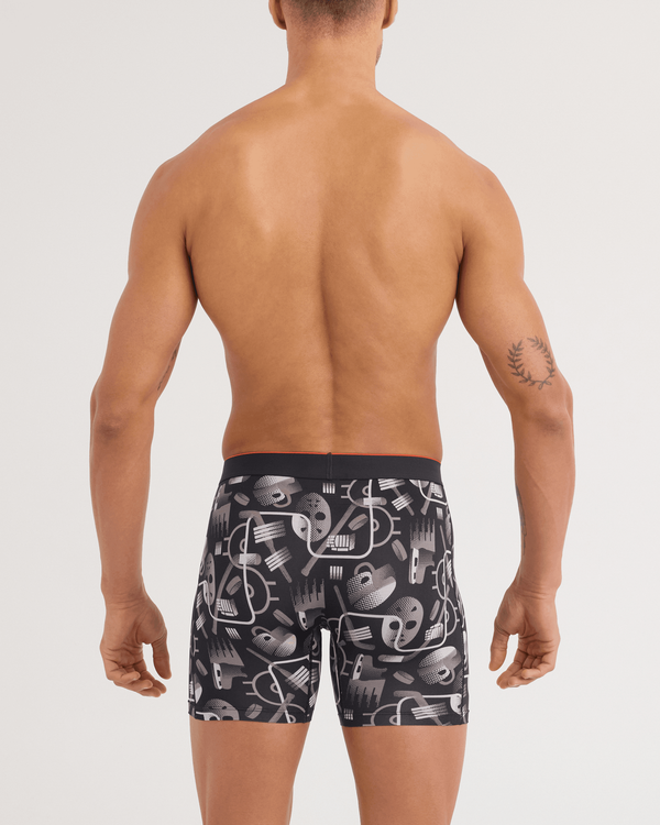 Back - Model wearing Multi-Sport Mesh Boxer Brief in Hockey Conduit-Black