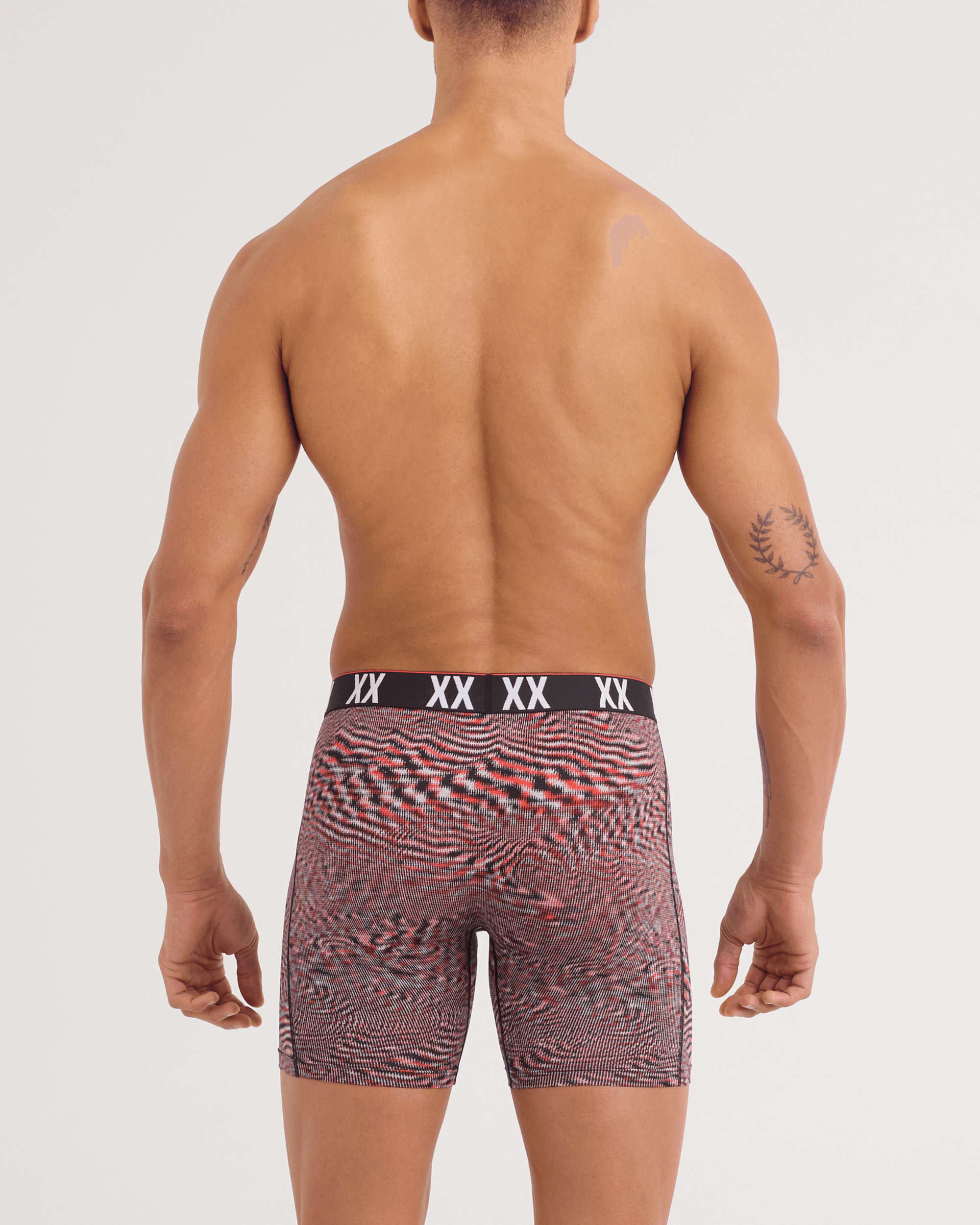 Back - Model wearing Multi-Sport Mesh Boxer Brief in Hyperspace-Red Hot