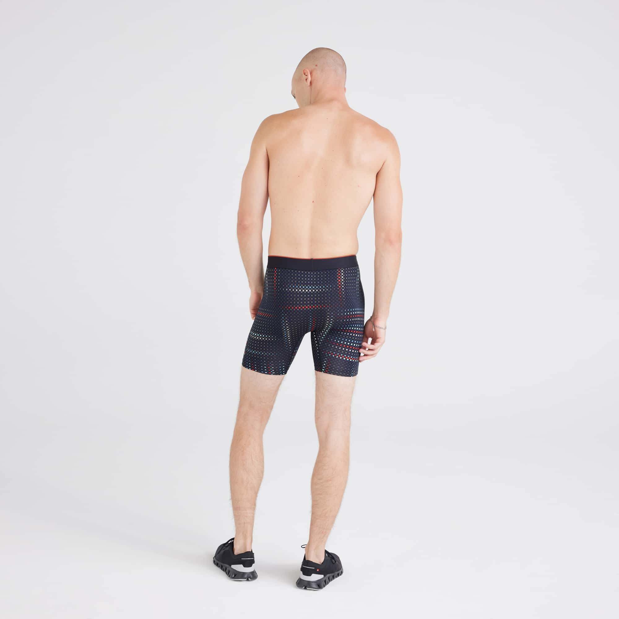 Back - Model wearing Multi-Sport Mesh Boxer Brief in Optic Grid-Black