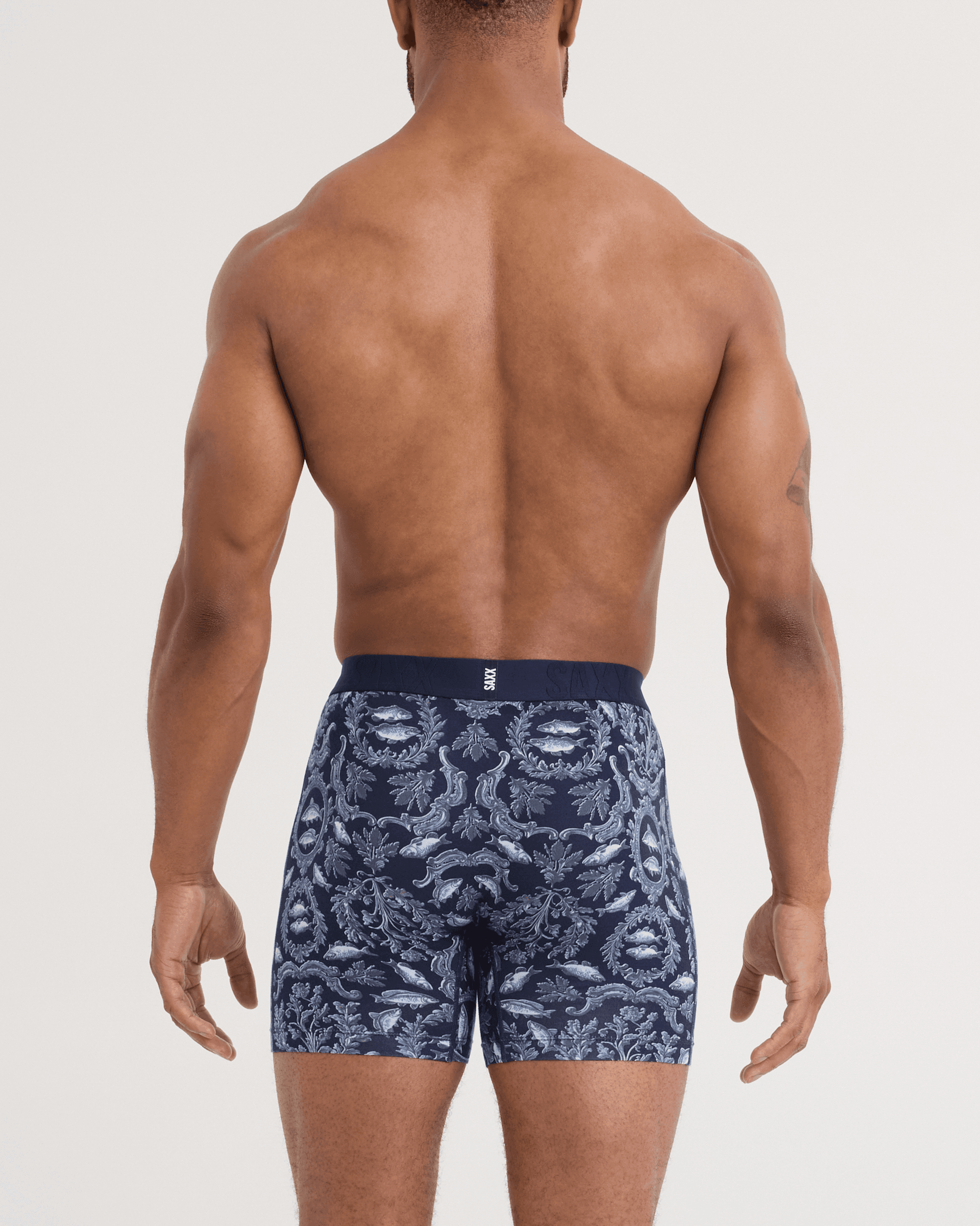 Back - Model wearing DropTemp Cooling Cotton Boxer Brief in Backsplash-Dark Ink