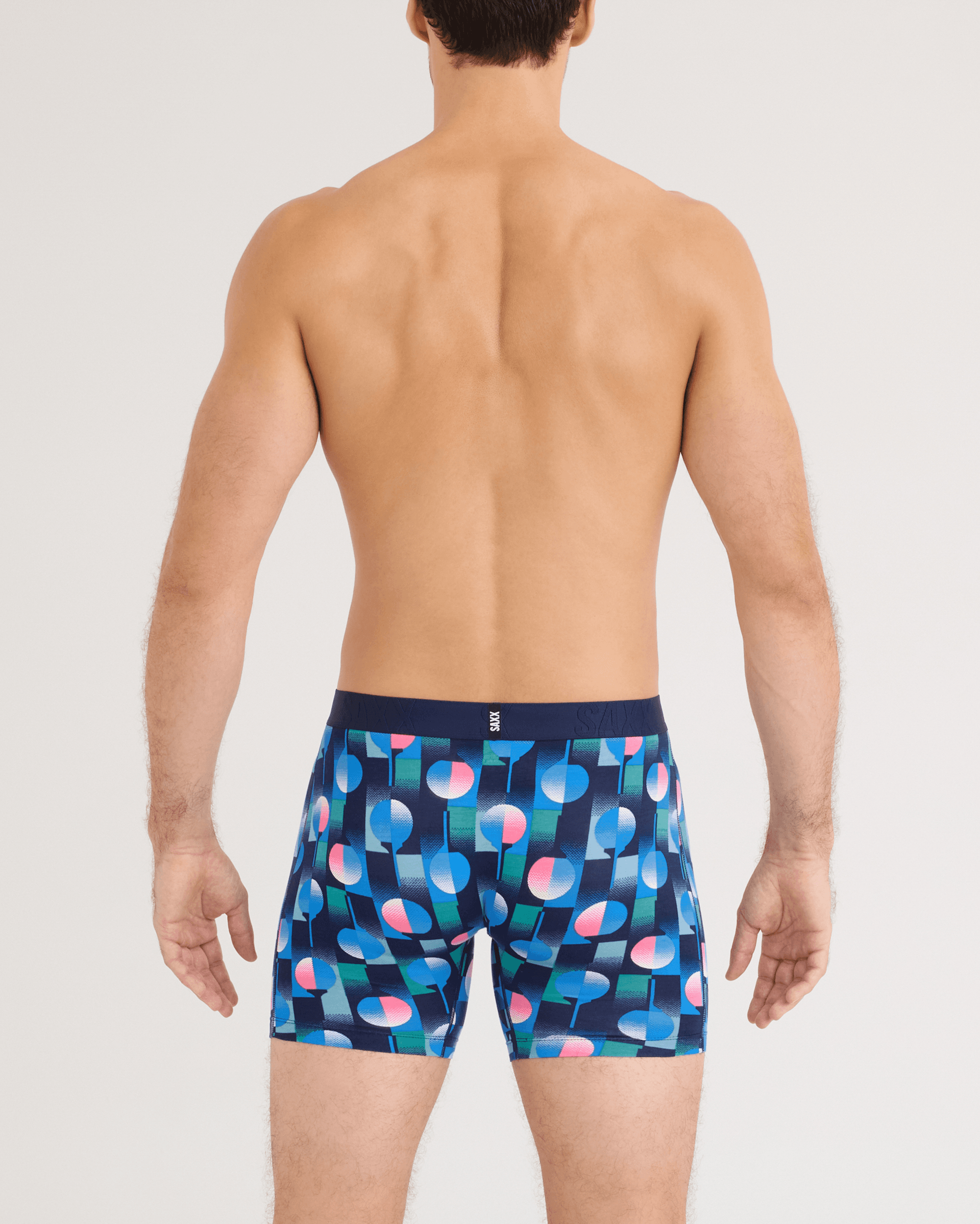 Front - Model wearing DropTemp Cooling Cotton Boxer Brief in Tee Up-Maritime Blue
