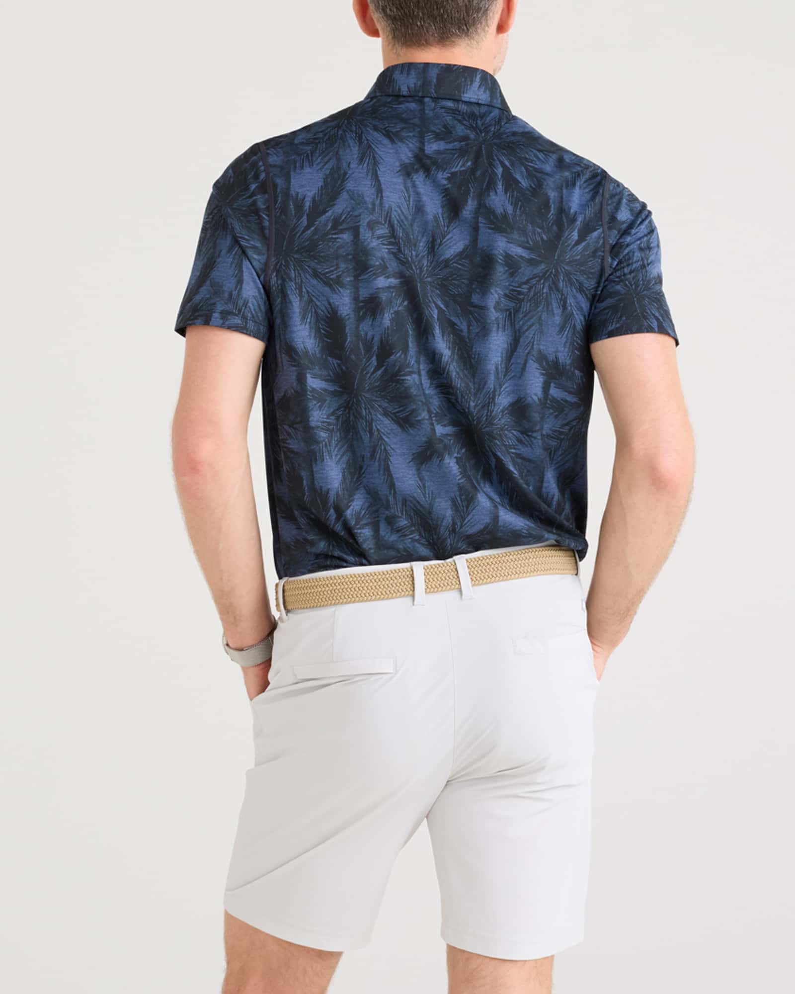 Back - Model wearing Droptemp All Day Cooling Polo in Vacation Vibes-Dark Denim