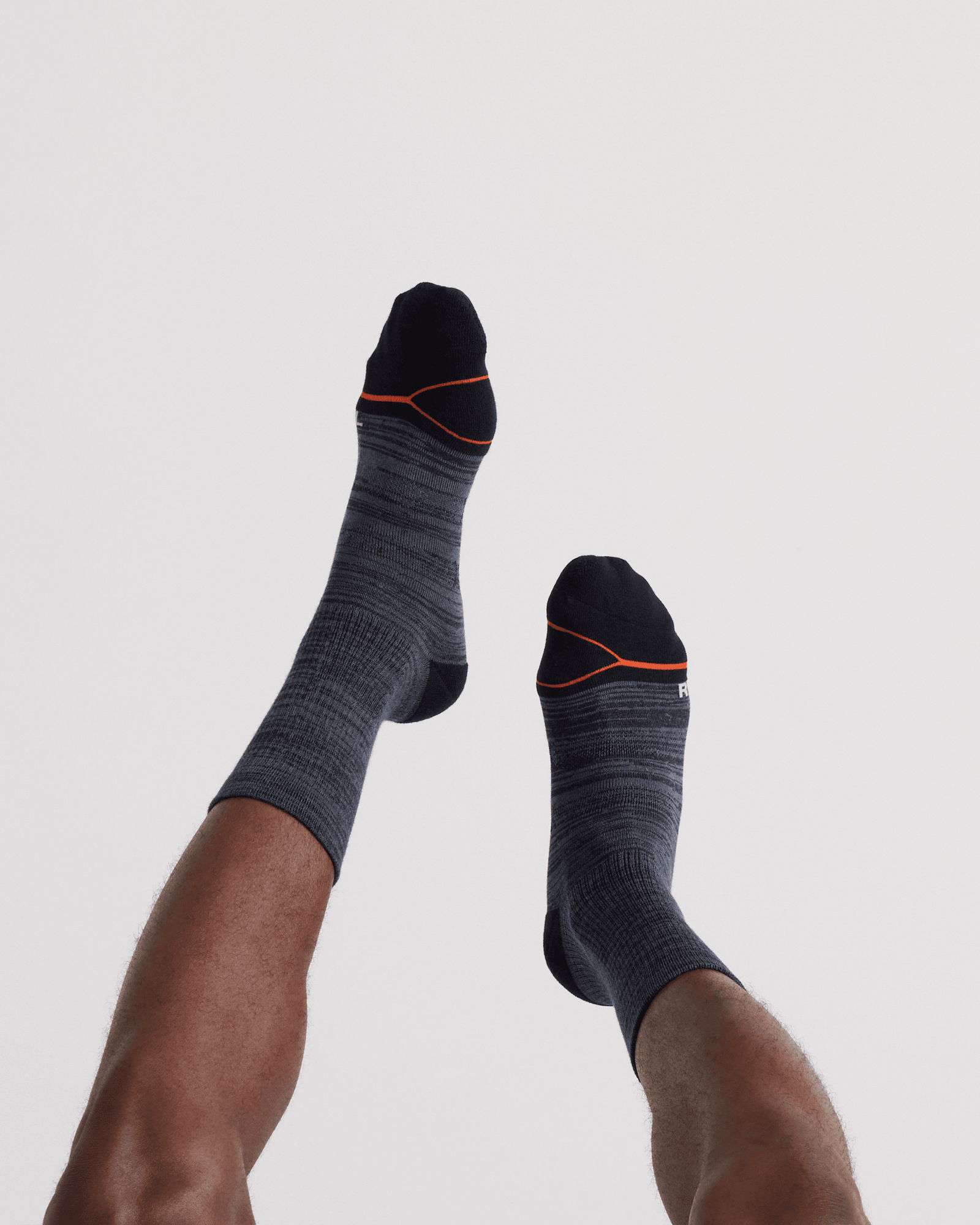 Back - Model wearing  Good Form Crew Sock in Black/Grey Stripe
