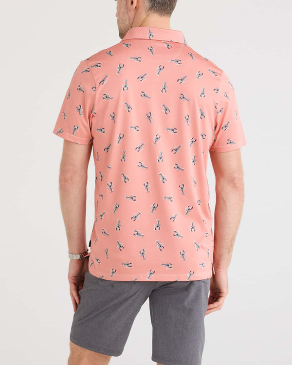 Back - Model wearing Droptemp Dry Polo in Lobster Boil-Burnt Coral