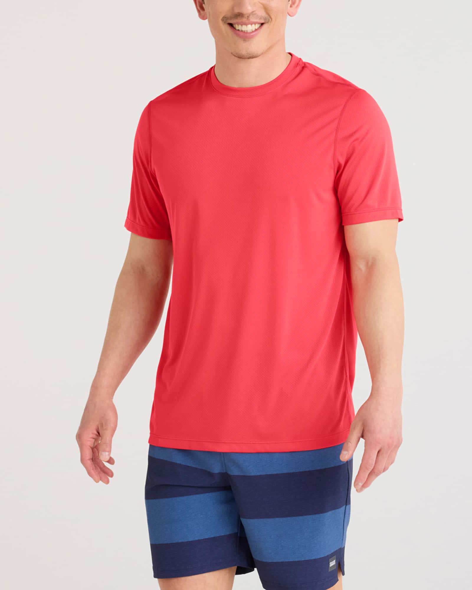 Front - Model wearing Multi-Sport Tech Tee in Coral Red