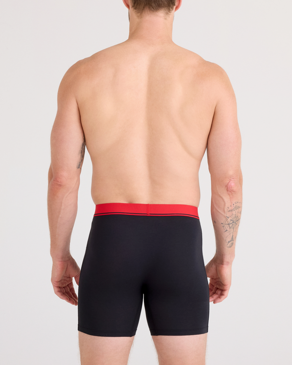 Back - Model posing in Essential Cotton Boxer Brief in Red/Navy/Turbulence Waistband