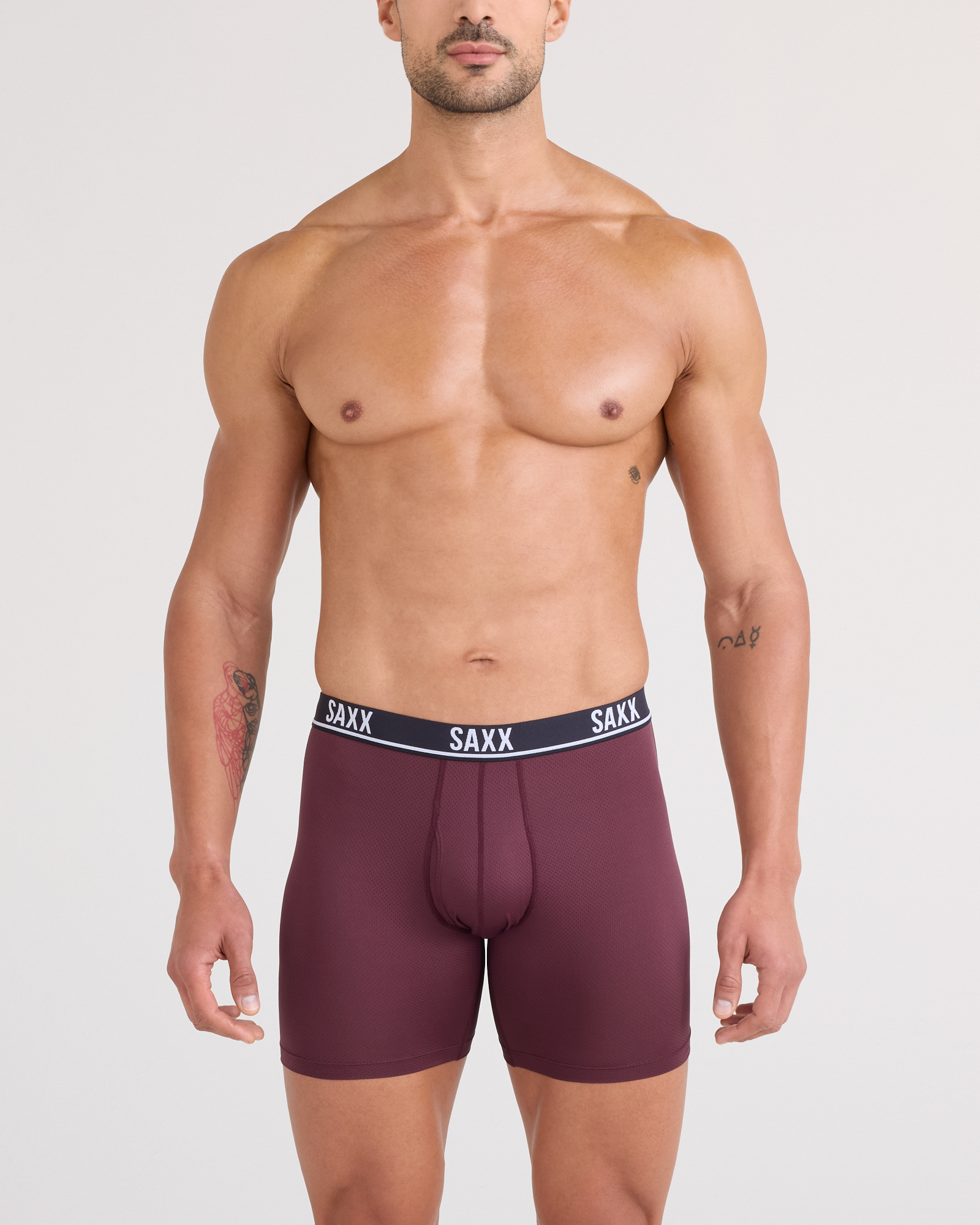 Front - Model posing in Essential Performance Mesh Boxer Brief in Maroon
