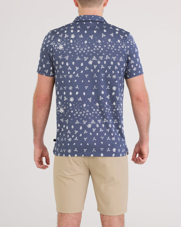 Back - Model wearing Droptemp Dry Resort Polo in Bandana Tropic-Indigo
