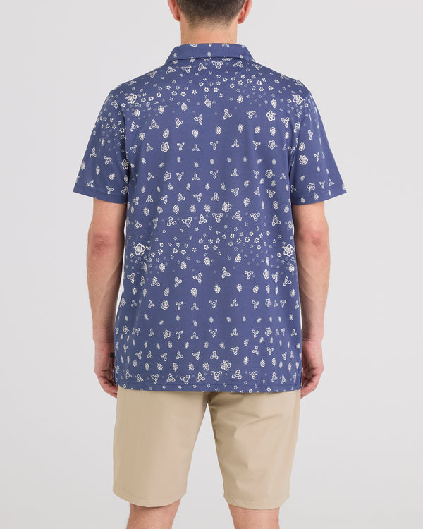 Back - Model wearing Droptemp Dry Resort Polo in Bandana Tropic-Indigo