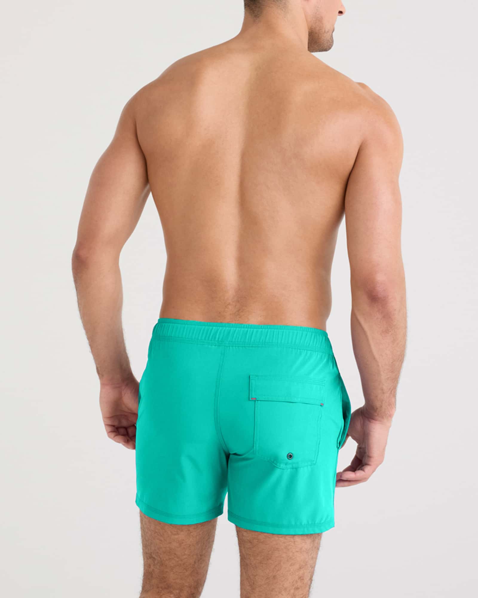 Back - Model wearing Oh Buoy 2N1 Swim Volley 5" in Peacock