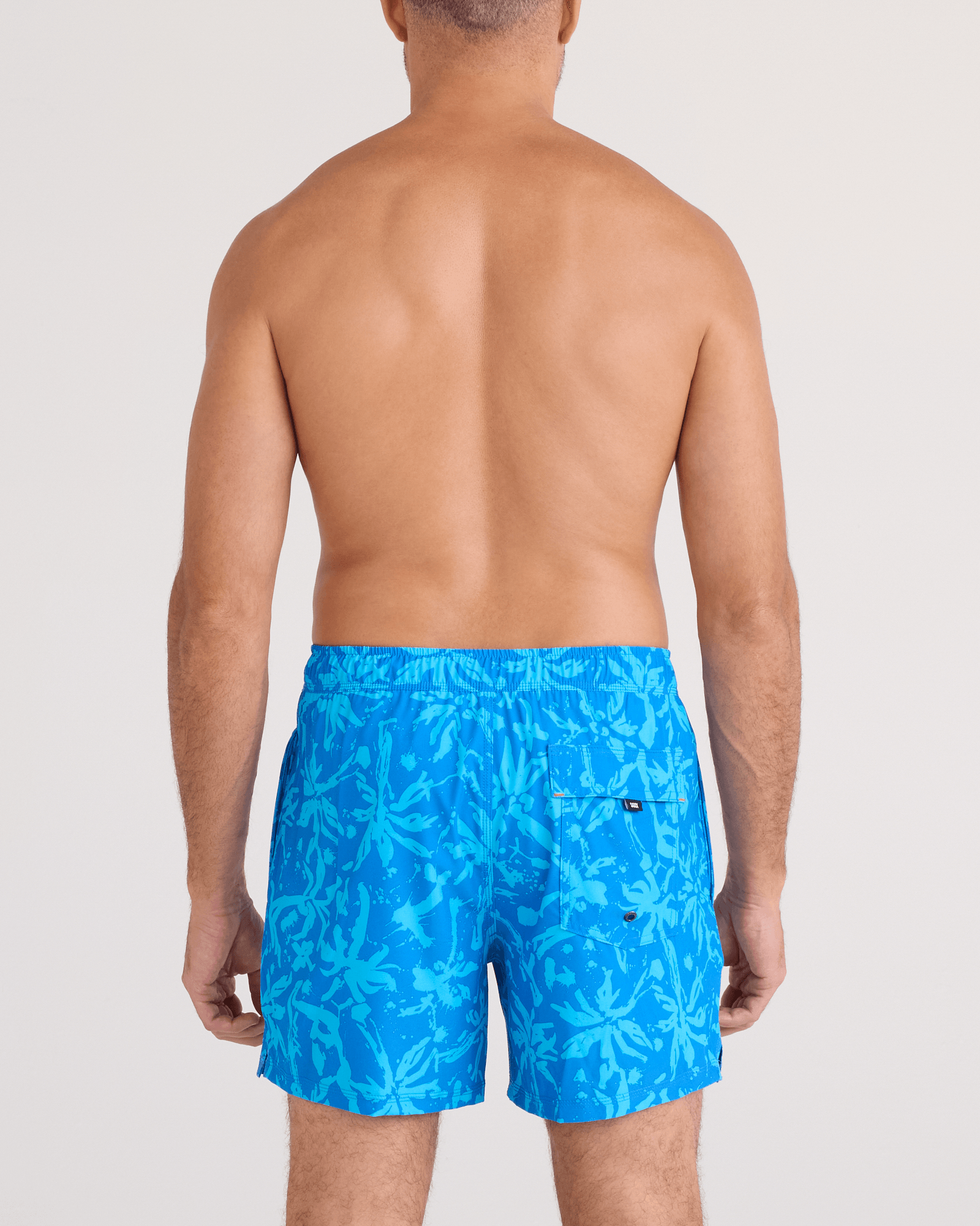 Back - Model wearing  Oh Buoy 2N1 Swim Trunk 5" in Splash Palms-Bold Blue
