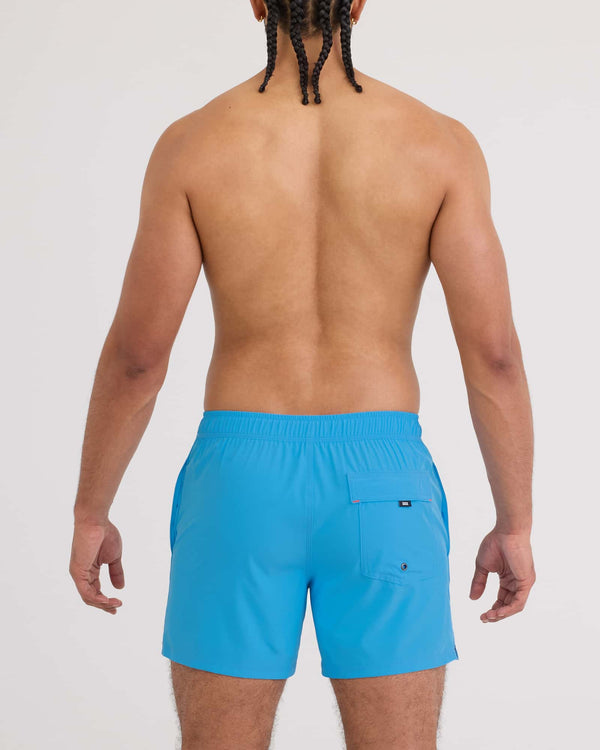 Back - Model wearing Oh Buoy 2N1 Volley 5" in Tranquil Blue