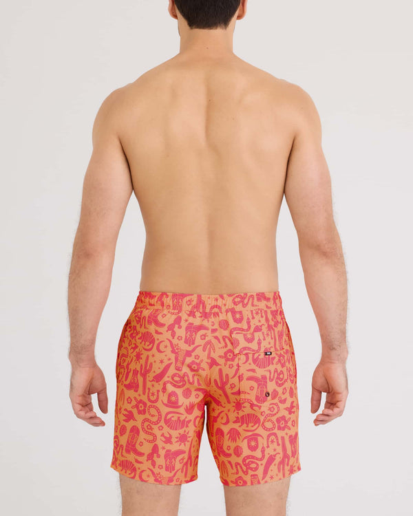 Back - Model wearing Oh Buoy 2N1 Volley 7" in Cactus Beach-Peach Jelly