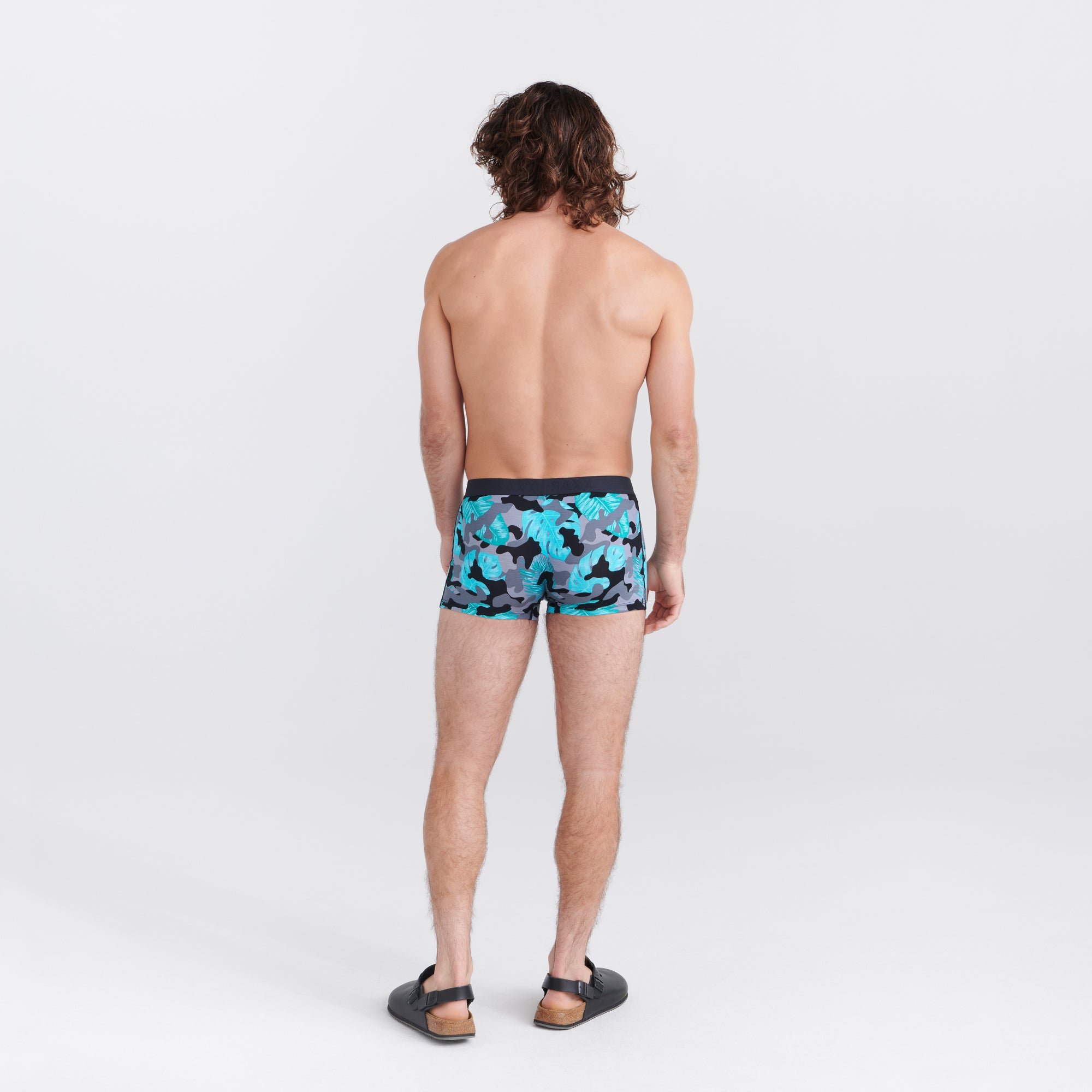 Back - Model wearing Vibe Super Soft Trunk in Island Camo- Black