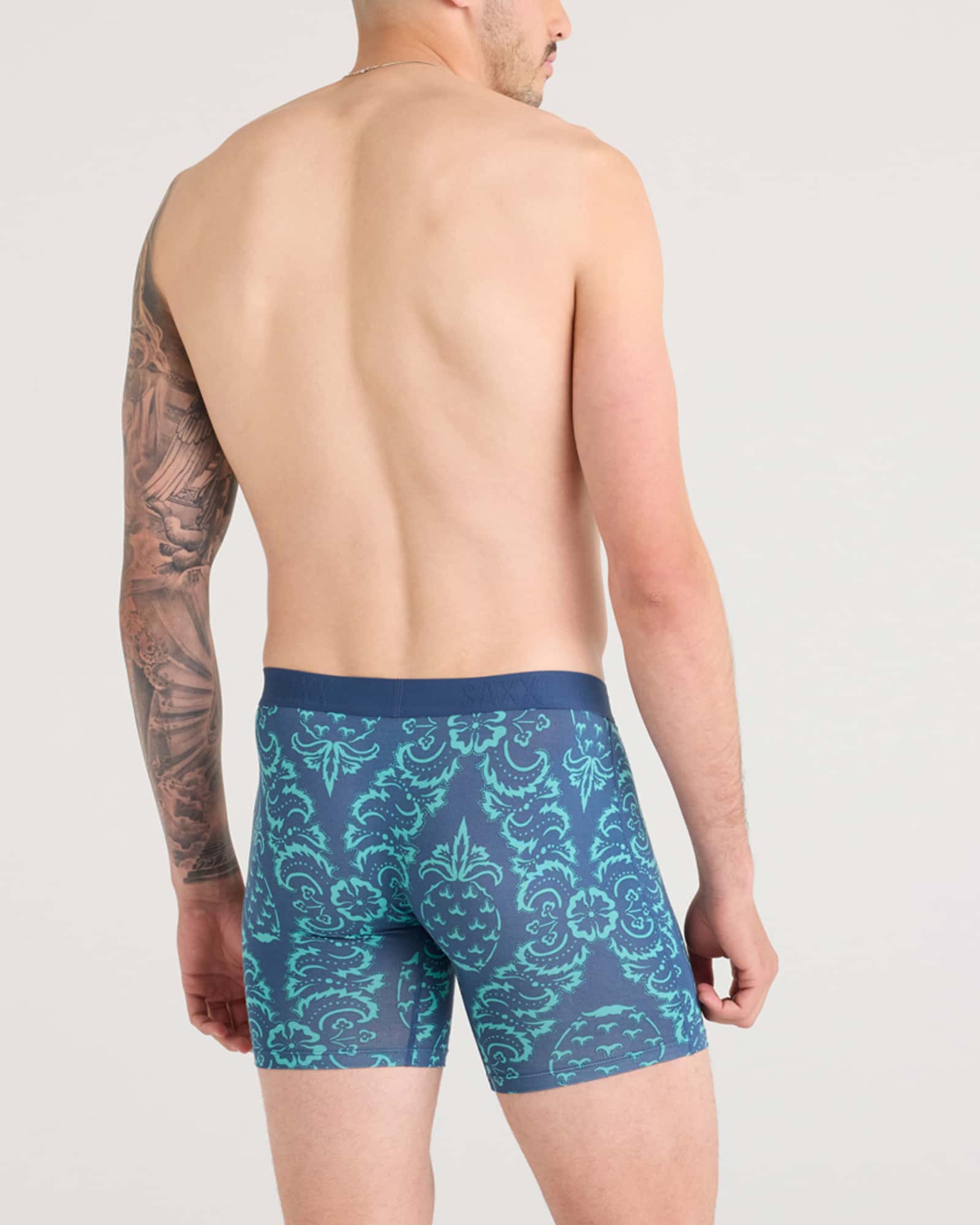 Back - Model wearing Vibe Xtra Boxer Brief in Pineapple Brocade-Navy