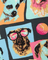 Fabric with dog prints in a grid pattern, featuring dogs wearing sunglasses and colorful backgrounds.