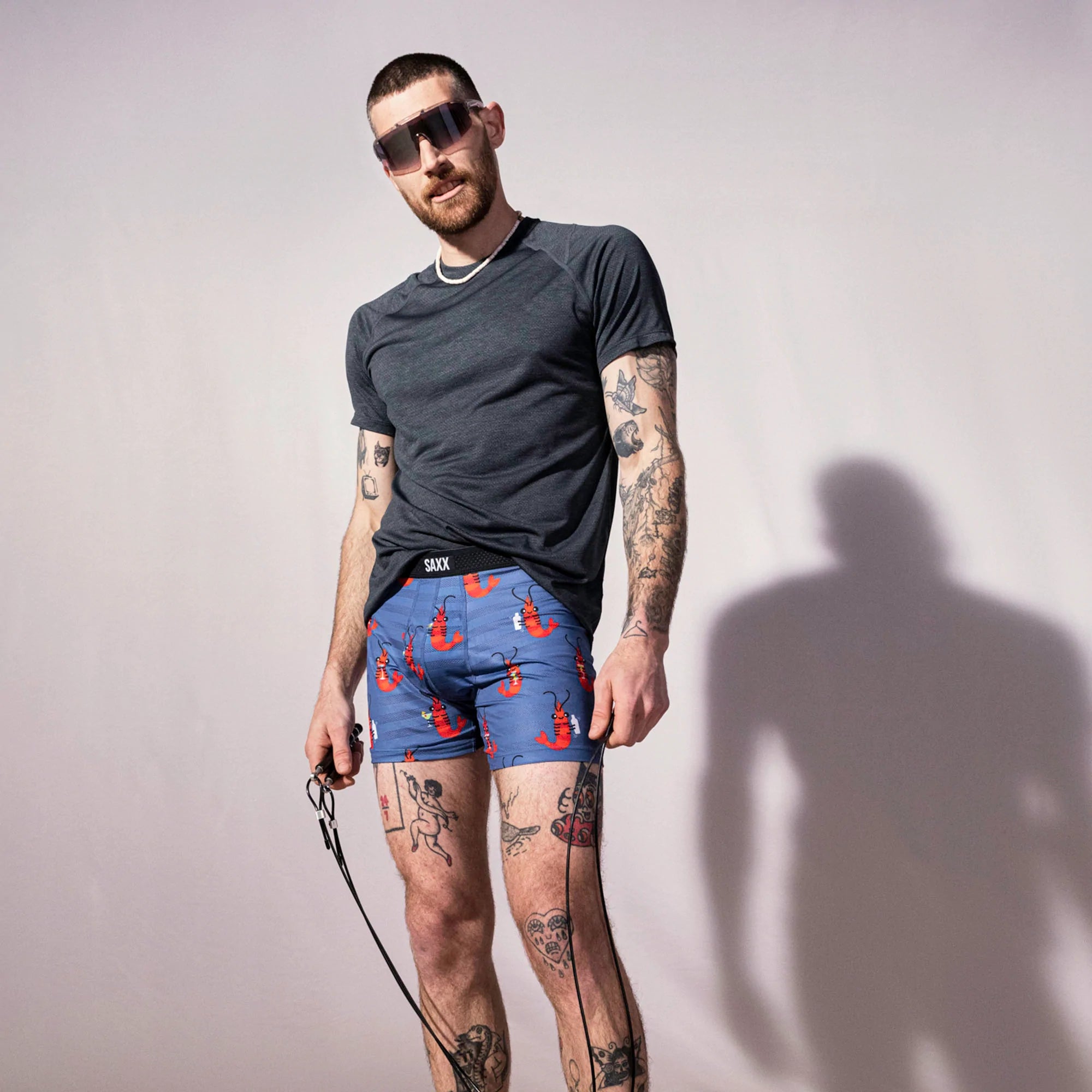 Model posing in Droptemp Cooling Mesh Boxer Brief Fly in Shrimp Cocktail- Navy