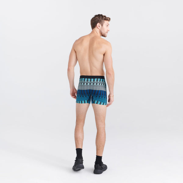 Back - Model wearing Daytripper Boxer Brief Fly in Frequency Stripe- Teal