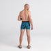 Back - Model wearing Platinum Boxer Brief Fly in Lush Tropics- Racer Blue