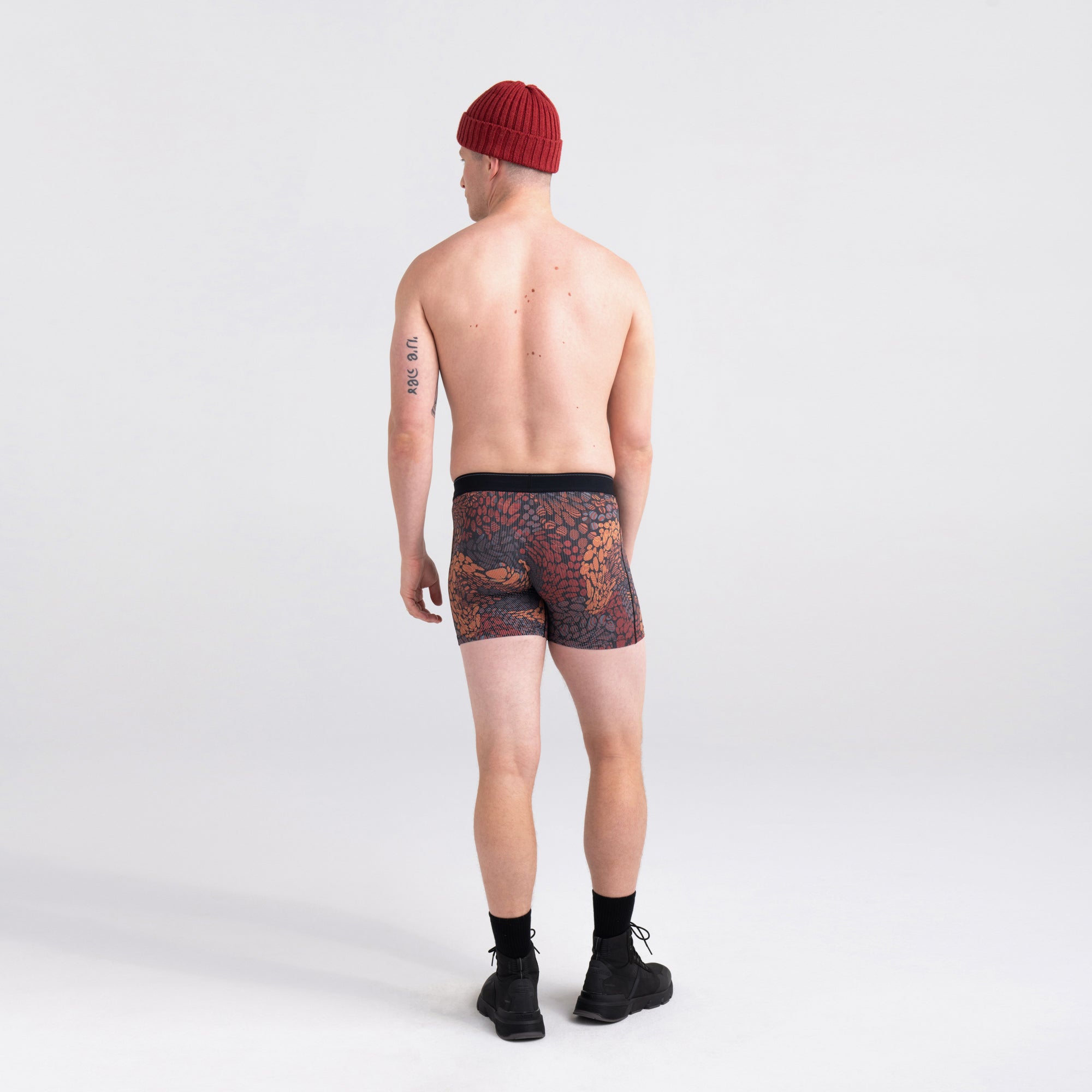 Back - Model wearing Quest Quick Dry Mesh Boxer Brief in River Rock Camo- Clay