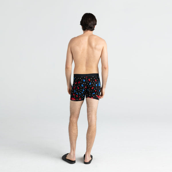 Back - Model wearing Vibe Boxer Brief in Black Beer Champs