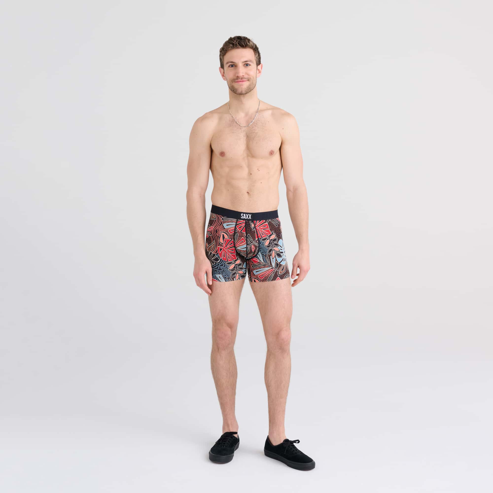 Front - Model wearing Vibe Boxer Brief in Desert Palms- Red Multi
