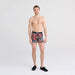 Front - Model wearing Vibe Boxer Brief in Desert Palms- Red Multi