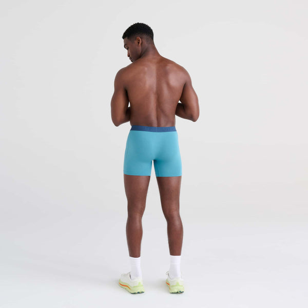 Back - Model wearing Vibe Boxer Brief in Hydro Blue