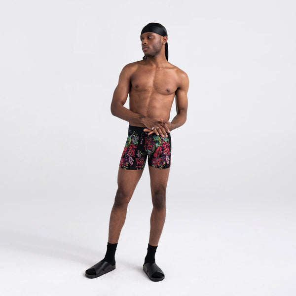 Front - Model wearing Vibe Super Soft Boxer Brief in Midnight Tropics- Multi