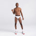 Front - Model wearing Non-Stop Stretch Cotton Brief in White