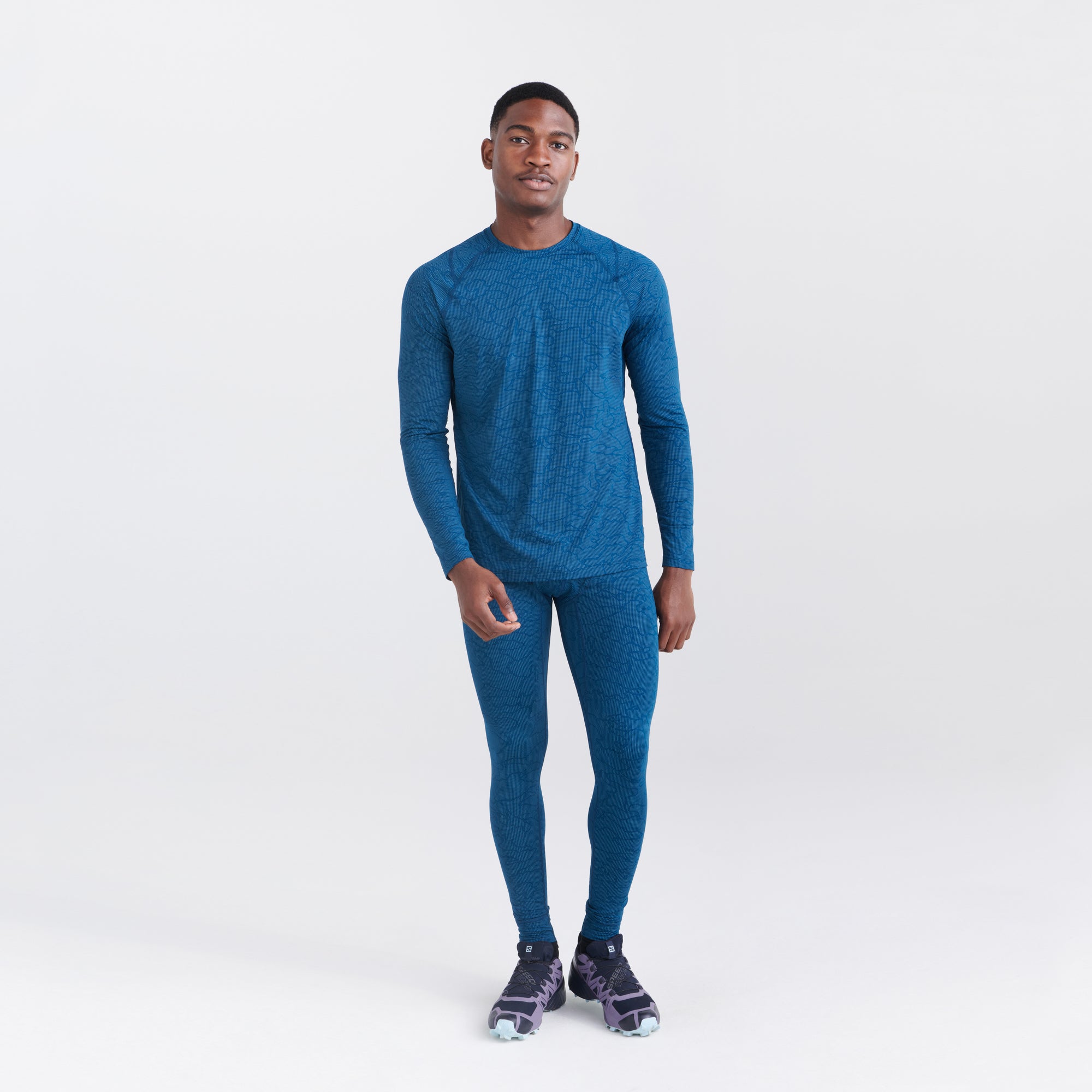 Front - Model wearing Quest Quick Dry Mesh Baselayer Long Sleeve Crew in Camo Jacquard- Teal