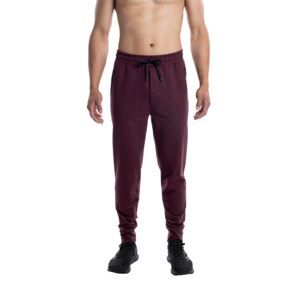 Front - Model wearing Trailzer Pant in Burnt Plum