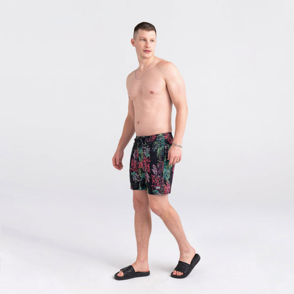 Front - Model wearing Betawave 2N1 Swim Short Regular in Midnight Tropics- Multi