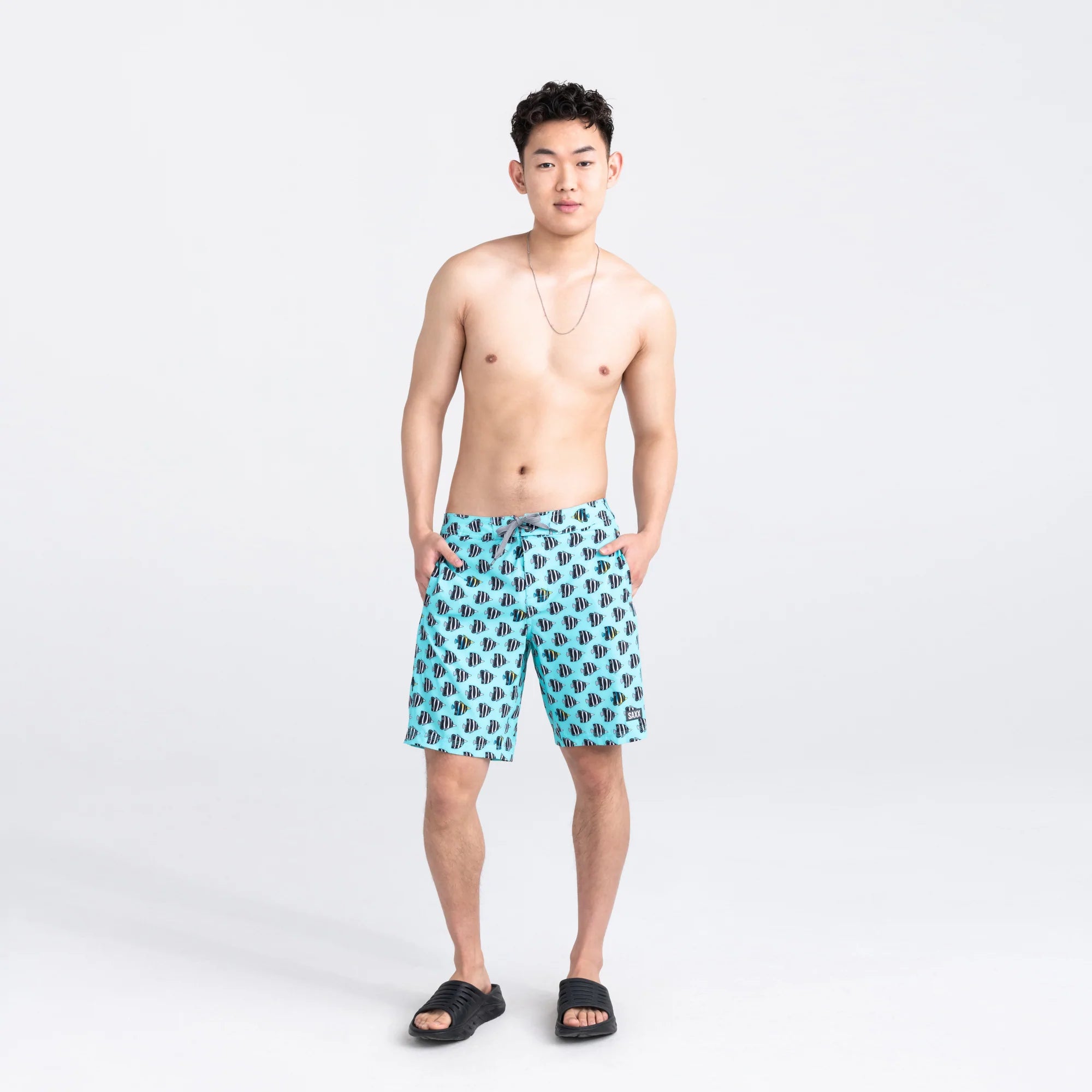 Front - Model wearing Betawave 2N1 Swim Board Short 19" in Fish Tank- Aqua