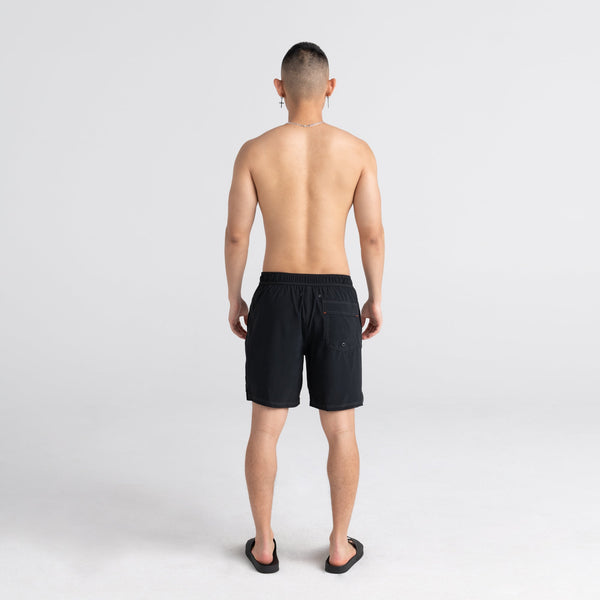 Back - Model wearing Oh Buoy 2N1 Swim Short 7" in Black