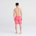 Back - Model wearing Oh Buoy 2N1 Swim Trunk 7" in East Coast- Hibiscus