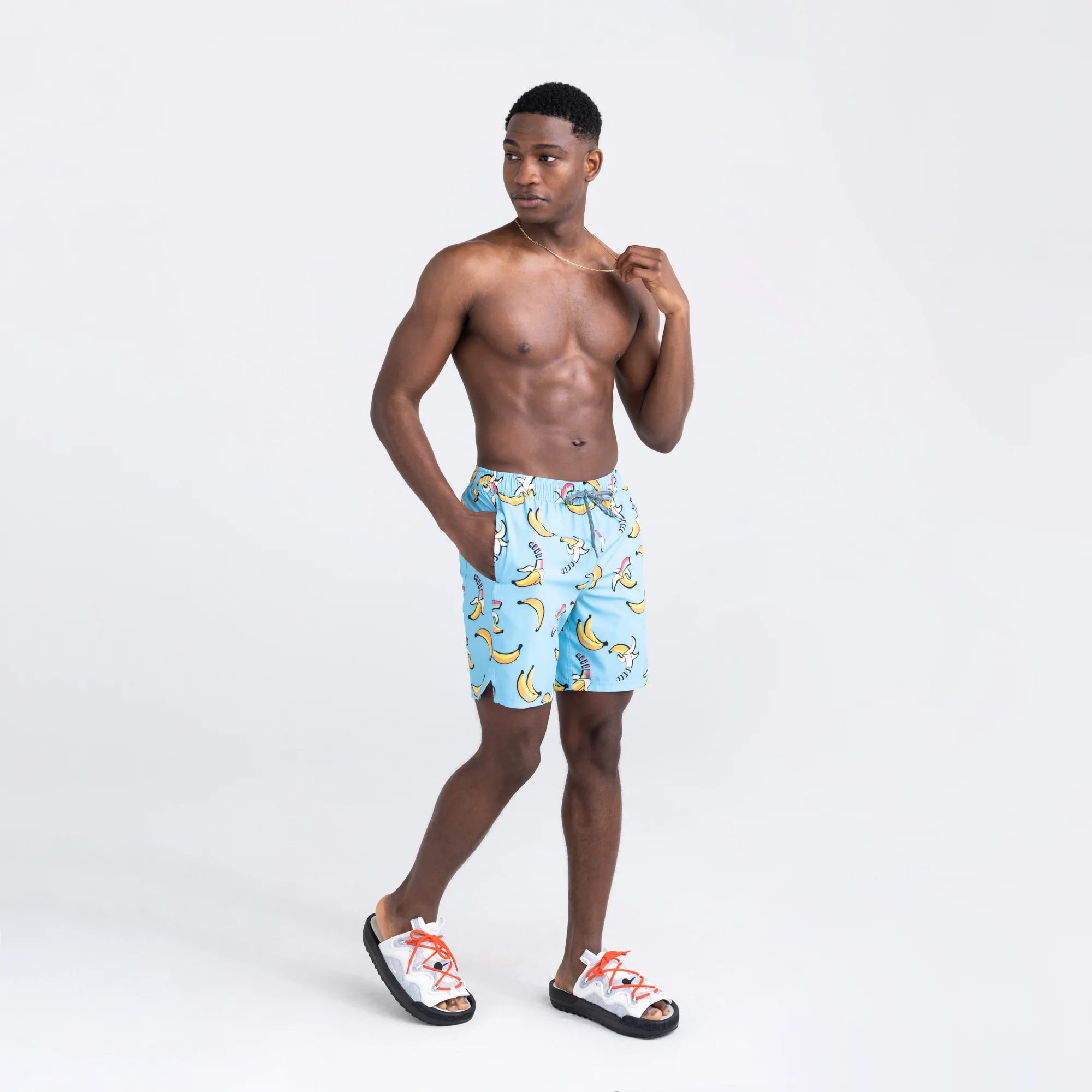 Front - Model wearing Oh Buoy 2N1 Swim Volley Short 7" in Rainbow Bananas- Azure